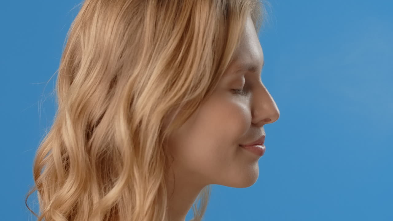 Woman with Blonde Wavy Hair Profile View