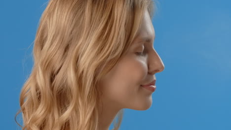 woman with blonde wavy hair profile view