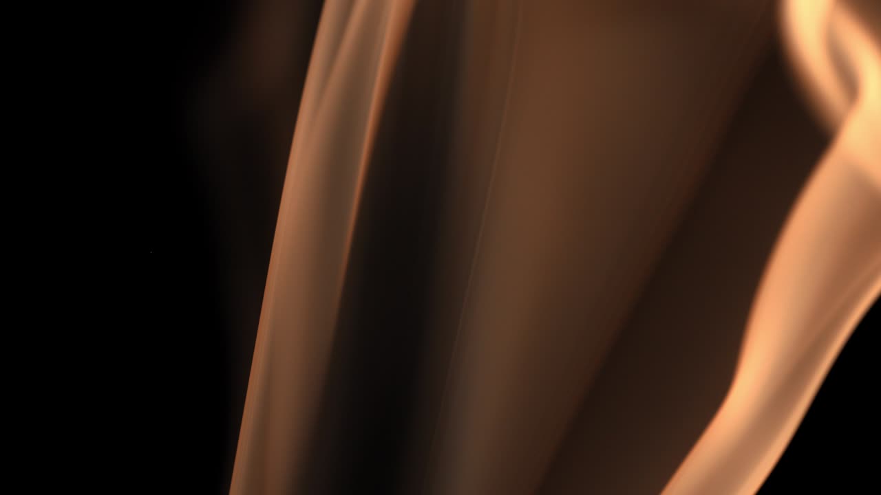 humo sobre un fondo negro. la luz ilumina tanto el humo que parece naranja.