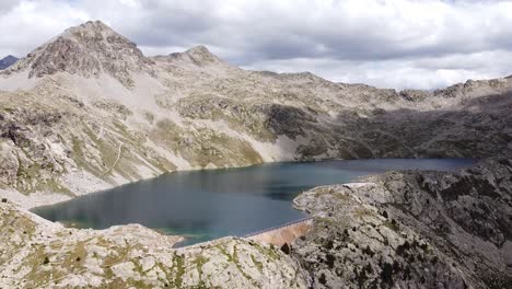 brazato lake at spanish pyrenees in panticosa, huesca, aragon, spain - aerial drone view