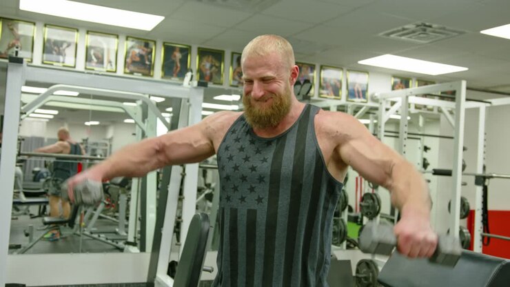 Functional Training With Dumbbells. Fit Man Fitness Training