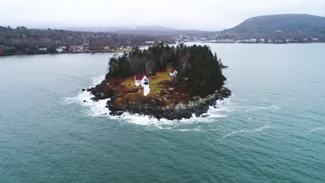 zooming aerial shot of curtis island lighthouse camden maine usa