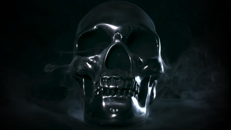 Metal-Silver-Skull-Rotating-on-Black-Background-with-Smoke-and-Mist