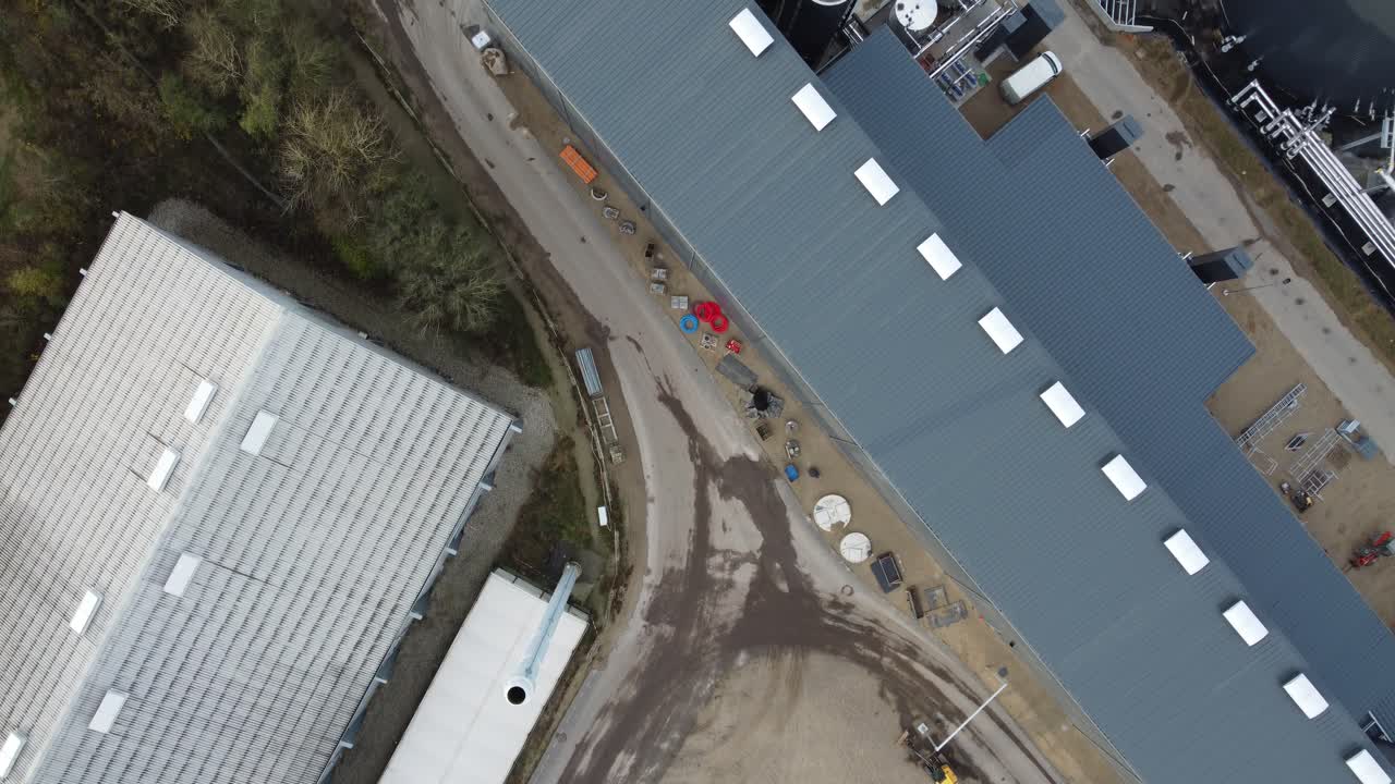 Drone footage of a renewable energy biogas facility in rural Denmark, showing industrial processing and sustainable power generation