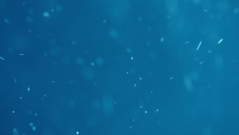 파란색 배경에 흰색 소용돌이 입자
