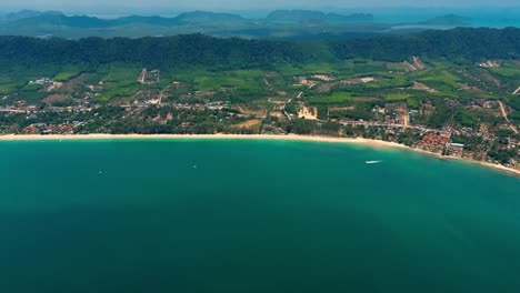 4K-Cinematic-nature-drone-footage-of-a-panoramic-aerial-view-of-the-beautiful-beaches-and-mountains-on-the-island-of-Koh-Lanta-in-Krabi,-South-Thailand,on-a-sunny-day