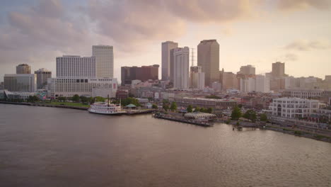 aerial fly from new orleans skyline to the mississippi river