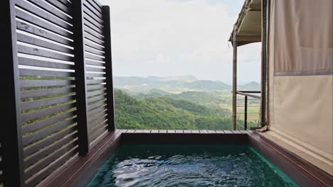 cinematic slider of infinity pool next to luxury gaming tent in lombok indonesia