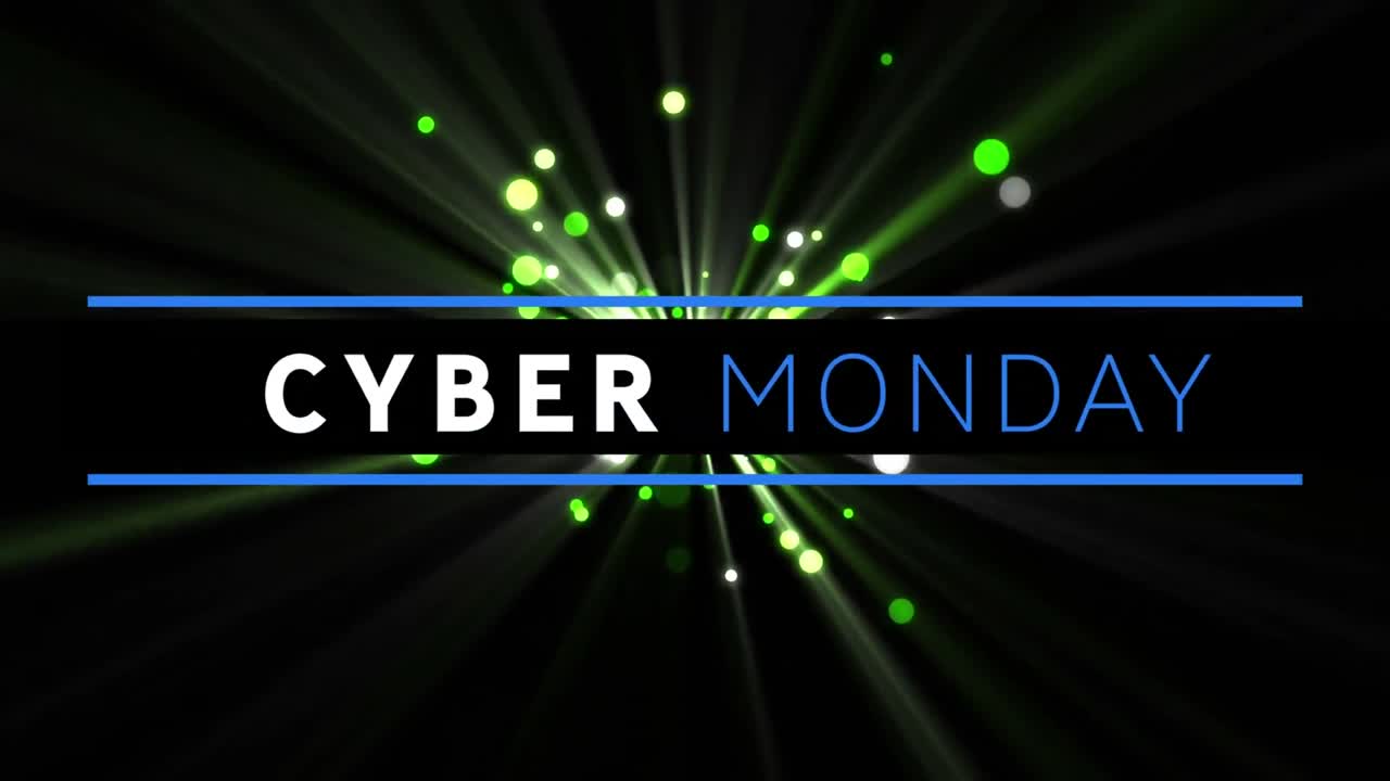 Digital animation of cyber monday text banner against green spots of light on black background
