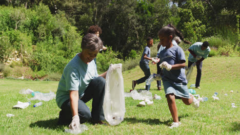 Happy-family-cleaning-a-garden-together