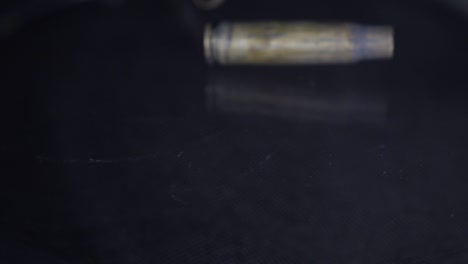 close-up of empty bullet shells falling to the ground