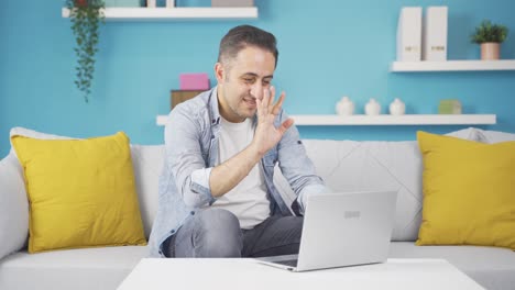 Man-making-video-call-on-laptop.