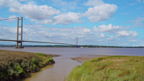 Behold-Humber-Bridge-in-this-drone-video,-the-world's-12th-largest-suspension-span,-elegantly-spanning-River-Humber,-connecting-Lincolnshire-to-Humberside-with-traffic