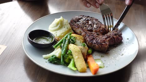 steak dinner with mashed potatoes and vegetables