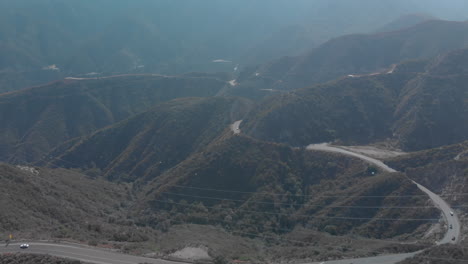 Drone-shot-traversing-over-the-mountains-in-Angeles-National-Forest-at-Sunset