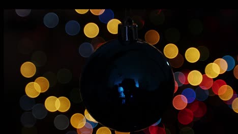 christmas ball at background of blurred lights