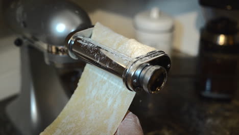 using pasta maching, rolling pasta flat with machine kitchen aid