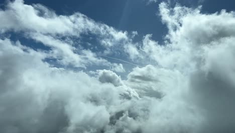 an unique pilot’s perspective: flying trough the clouds in a splendid sunny day