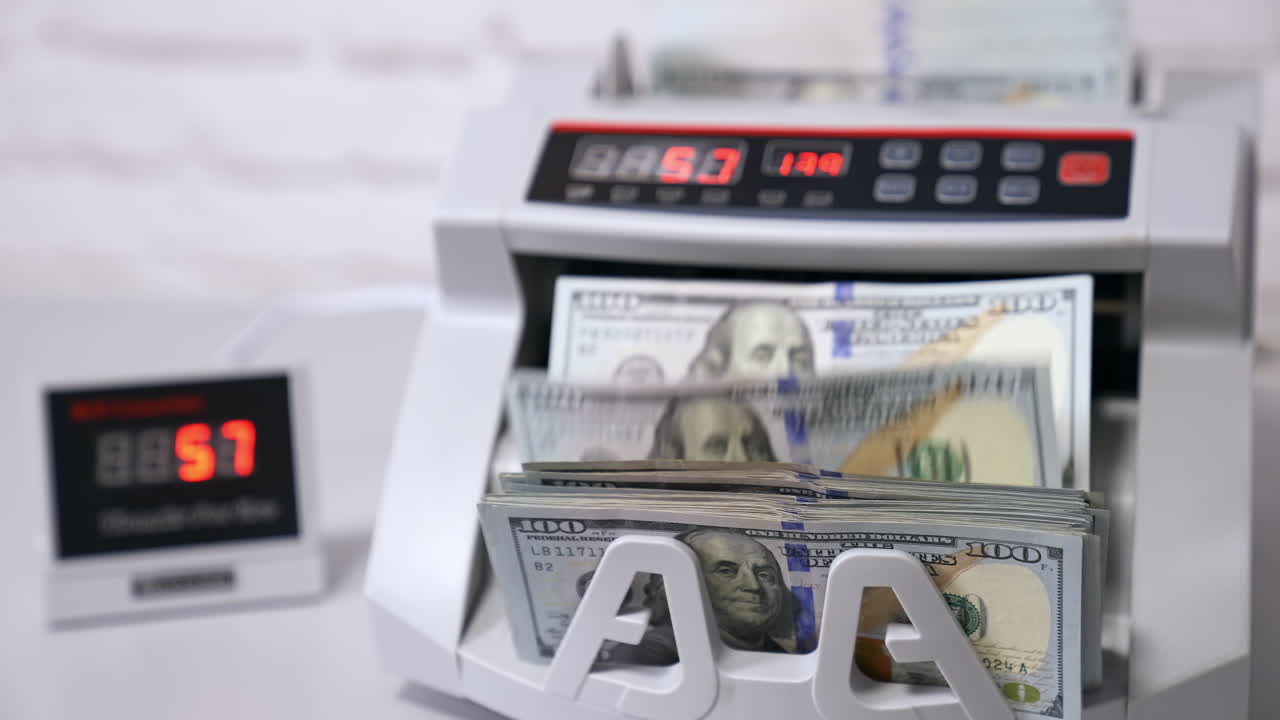 Counting machine for USD dollar paper banknote. Banknote counter.