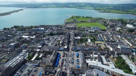 drone pullback over dungarvan town in waterford ireland buseling seaside town ireland epic locations