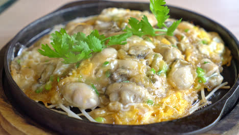 oyster omelette with bean sprout on hot pan - asian food style