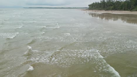 drone views of sempadi beach during monsoon season raining day asian tropical,sarawak,borneo