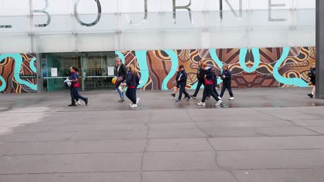 group of children walking outside melbourne museum