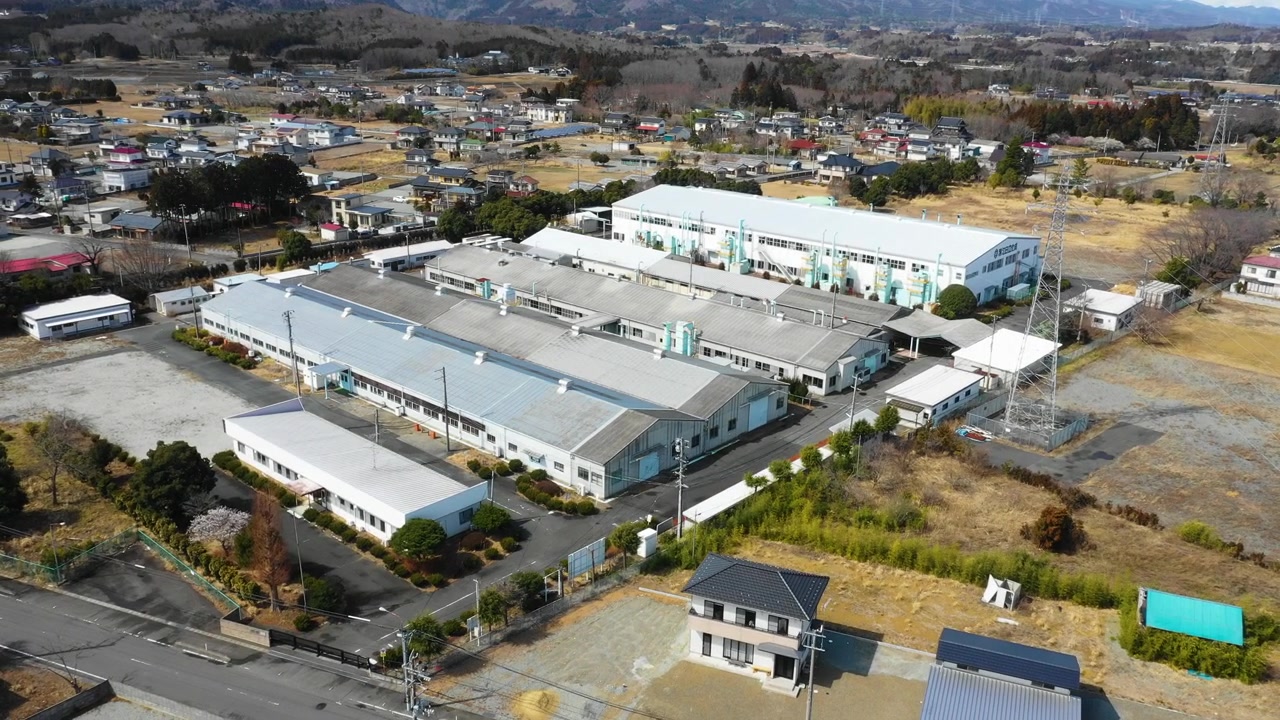 A drone flies over an industrial complex in Tomioka, Fukushima.