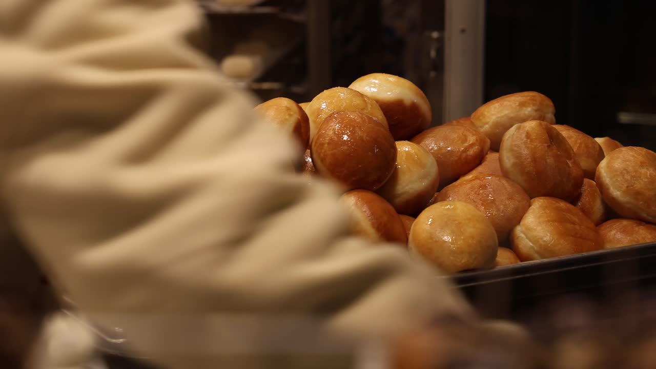 Fresh Berliner style donuts made in the factory market