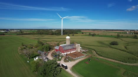 above a farm, a wind turbine blows in the wind of the wisconsin countryside