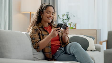 Happy-woman,-phone-and-credit-card-on-sofa