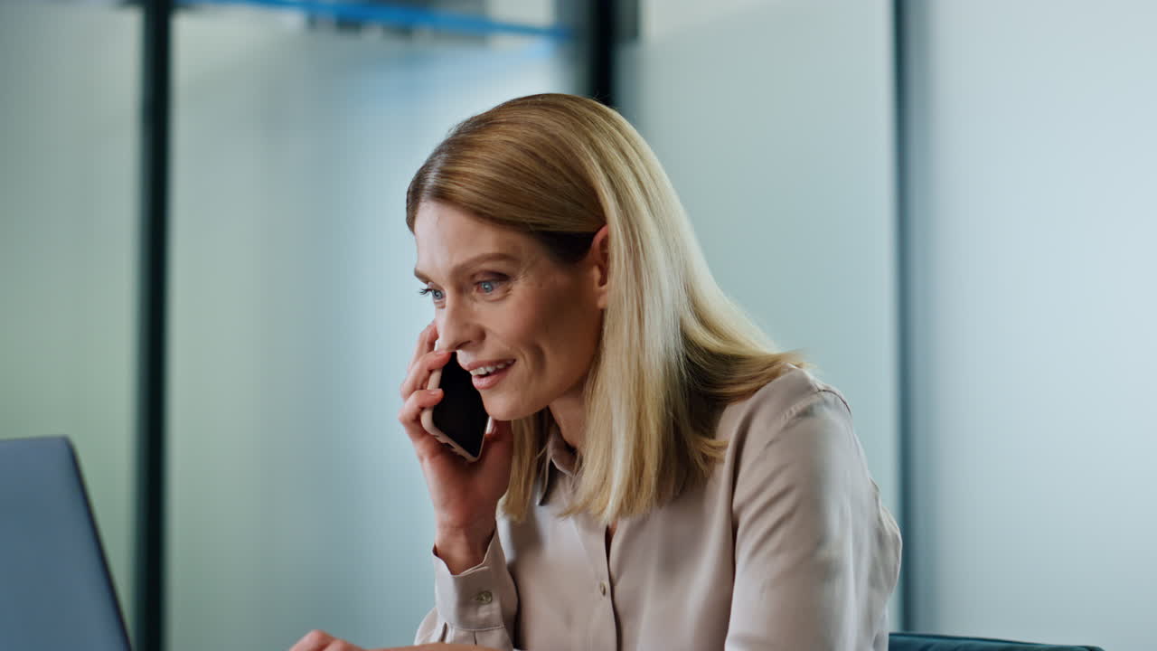 Surprised woman wondering smartphone workplace close up. Lady mobile phone call