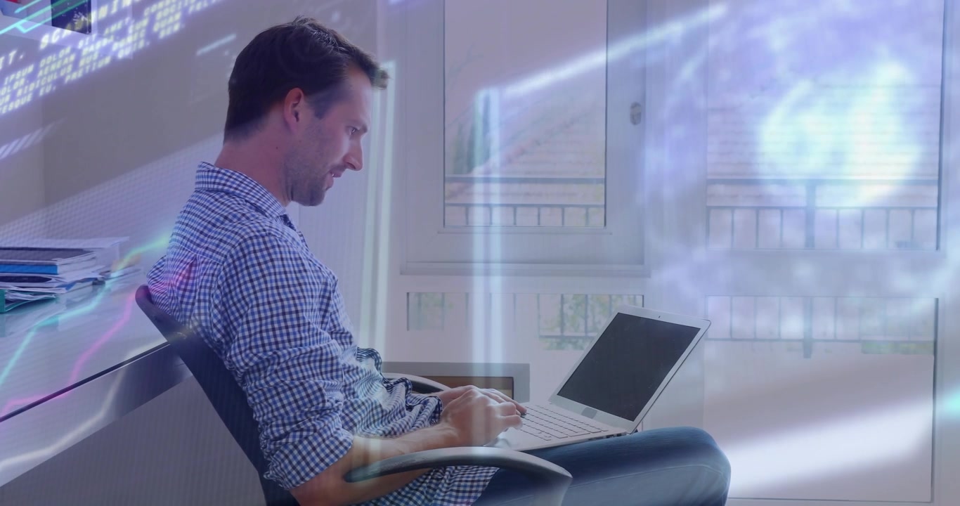 Office worker opening laptop and coding while holographic code projections visualizing data flow