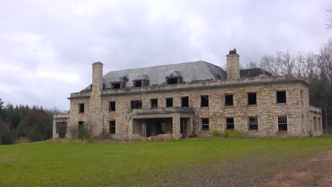 time lapse of an abandoned and spooky old boarding school or mansion in the countryside 1