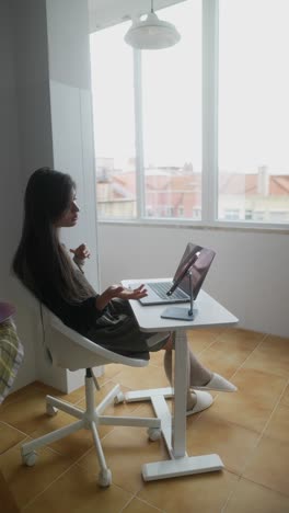 woman having a video call in a home office