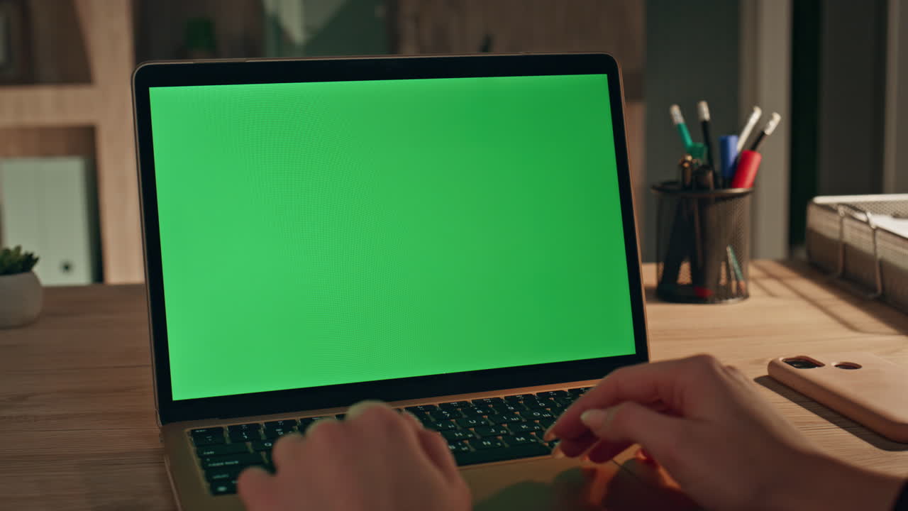 Woman hands typing chroma key laptop at home close up. Businesswoman surfing