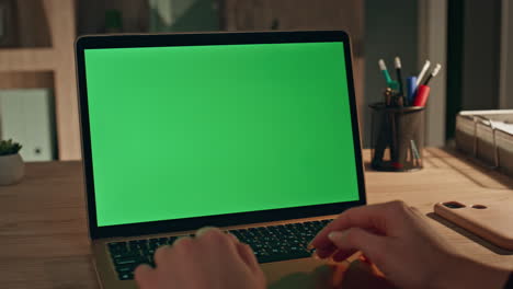 woman hands typing chroma key laptop at home close up. businesswoman surfing