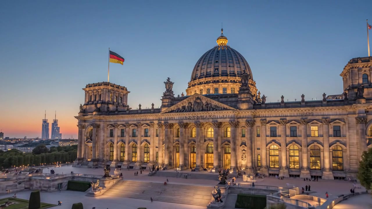 Luftfoto af Rigsdagsbygningen i Berlin ved solnedgang