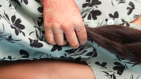 child with mehndi and long hair