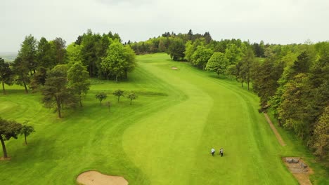 aerial drone flyover shot of hole on glenrothes golf course in fife, scotland