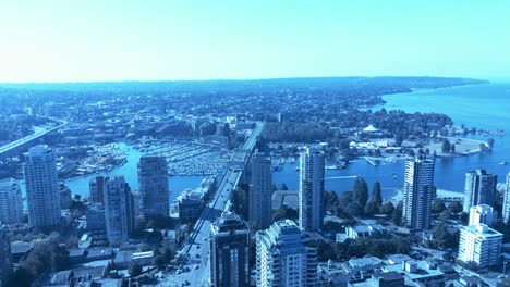 Burrard-Street-bridge-flyover-downtown-Vancouver-to-Kitsilano-overlooking-Yaletown-boating-club-docked-yachts-sunny-summer-day-reveal-posh-living-in-the-most-luxury-highrise-buildings-vanstock1-2