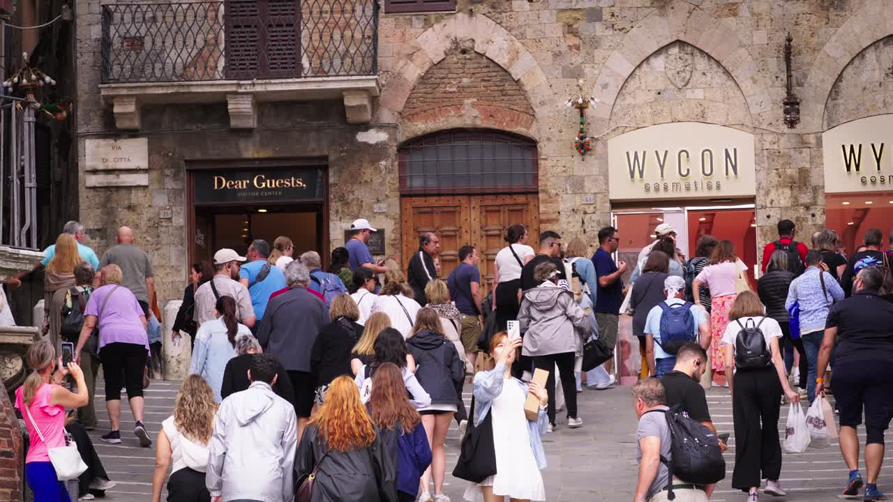 Large Crowd of Tourists in Historic European City Center