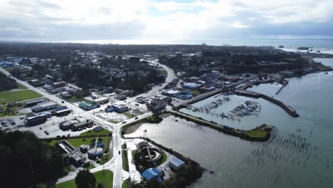 beautiful 4k aerial drone shot peaking over old town bandon in southern oregon