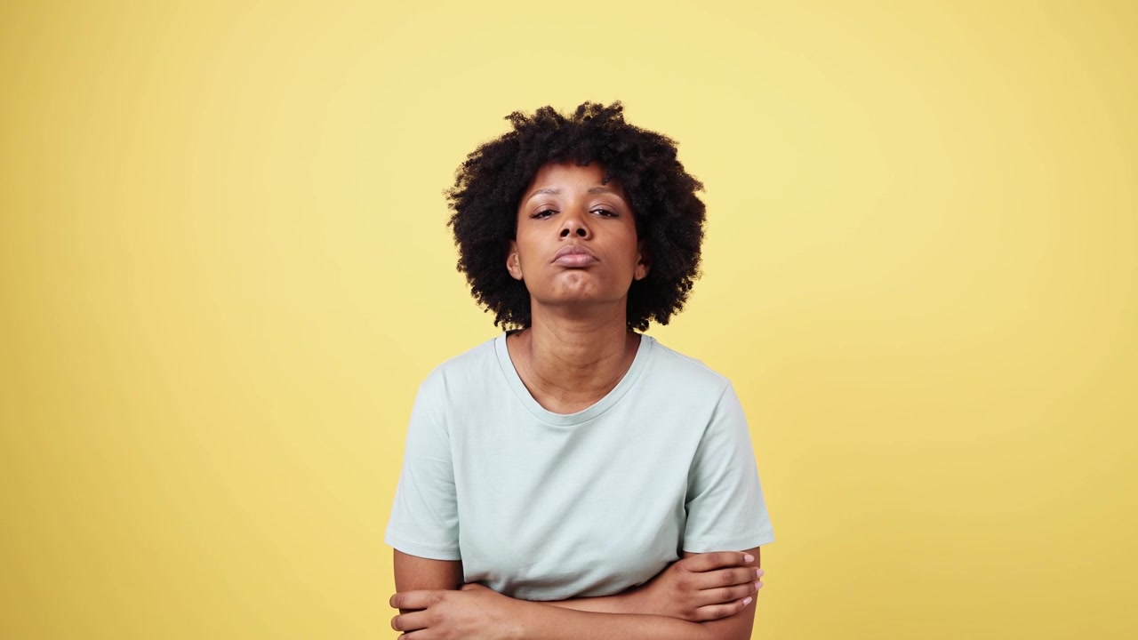 Young Black Woman Sighing with Bored and Tired Expression
