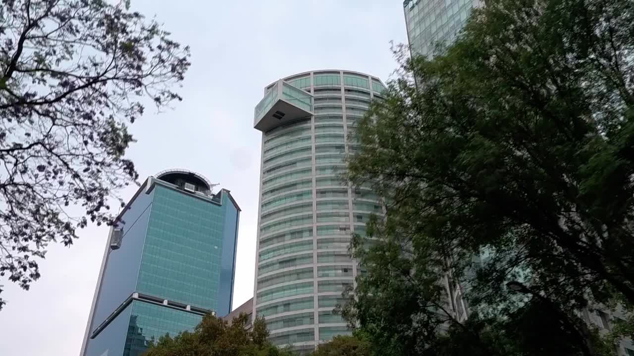 Corporate office skyscrapers and luxury apartments on Paseo La Reforma. Mexico City. Street view.