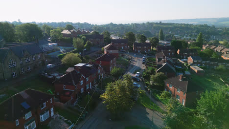 Aerial-video-unveils-Dewsbury-Moore-Council-estate,-UK:-red-brick-homes-and-Yorkshire's-industrial-charm-on-a-sunny-summer-morning