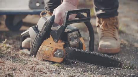 slowmotion shoot of man cutting wood