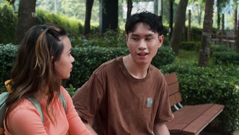 Boy-and-girl-talking-in-the-park