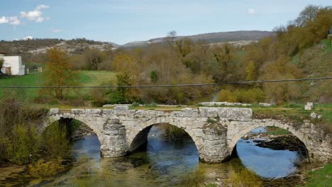 a small stone bridge from roman times over a river