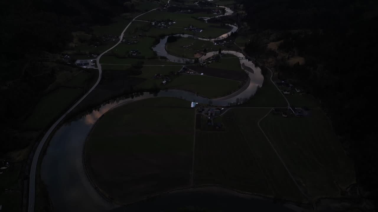 Aerial View of a Serene River Valley at Dusk